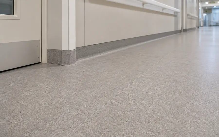 Heterogeneous sheet vinyl with decorative print layer in a UAE school or healthcare ward