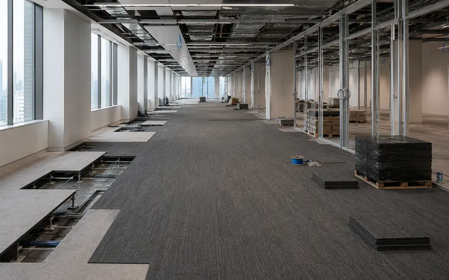 Office fit-out flooring on a UAE corporate project with carpet tiles and LVT