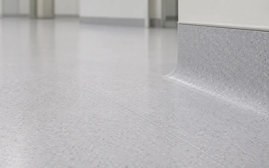 Heat-welded homogeneous sheet vinyl flooring with flash coving in a UAE healthcare facility